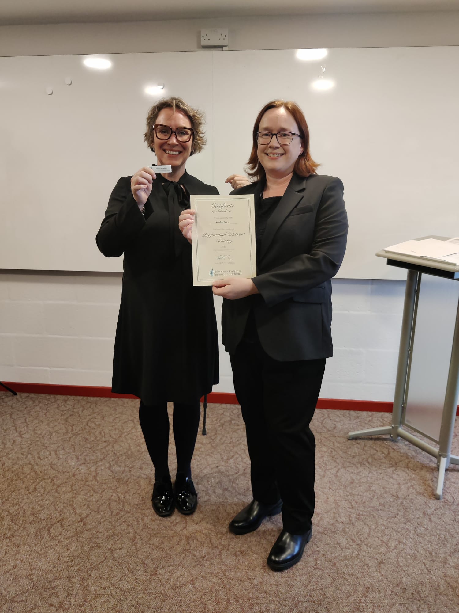Image of Jess holding her certifcate from the ICPC after training
